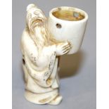 A SIGNED 19TH/20TH CENTURY JAPANESE CARVED IVORY NETSUKE OF A MAN HOLDING ALOFT A BUCKET, 2.1in