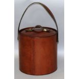 A LEATHER AND BRASS BOUND ICE BUCKET. 9ins high.