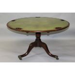 A GOOD 19TH CENTURY MAHOGANY CIRCULAR TILT TOP GAMING TABLE, with gilt tooled leather top, five
