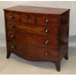 AN EARLY 19TH CENTURY MAHOGANY BOWFRONT CHEST OF DRAWERS, with three small drawers over three