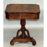 A 19TH CENTURY MAHOGANY CONCAVE FRONTED WORK TABLE with lifting lid on turned and carved baluster