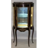 A FRENCH STYLE MAHOGANY AND ORMOLU MOUNTED BOWFRONT VITRINE with single glazed door on cabriole