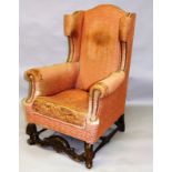 A QUEEN ANNE STYLE WING ARMCHAIR (for restoration).