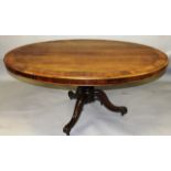 A 19TH CENTURY ROSEWOOD TILT TOP BREAKFAST TABLE, with an oval top supported on a turned and