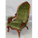 A VICTORIAN MAHOGANY OPEN ARMCHAIR on cabriole legs.