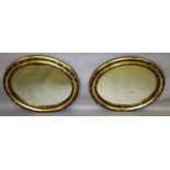 A GOOD PAIR OF 19TH CENTURY IRISH OVAL MIRRORS. 2ft 4ins x 21ins.