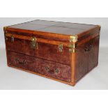 A LARGE LEATHER TRUNK, with brass mounts, the lifting lid above a drawer. 3ft 0ins wide x 2ft 0ins