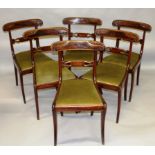 A SET OF SIX REGENCY MAHOGANY DINING CHAIRS, with carved overhanging cresting rails, pierced and