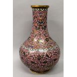 A LARGE GOOD QUALITY 19TH CENTURY CHINESE PINK GROUND CLOISONNE VASE, the sides decorated with an