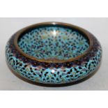 A SMALL EARLY 20TH CENTURY CHINESE CLOISONNE BOWL, decorated overall with scrolling foliage, the