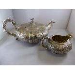 MELON SHAPED SILVER TEAPOT WITH EMBOSSED DECORATION AND INDIAN FIGURE FINIAL, ROBERT HENNELL, LONDON