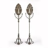 A pair of Spanish Colonial style cast iron three light torchieres Late 19th / early 20th century,