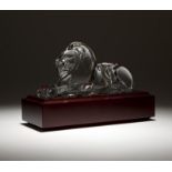 A Steuben cut crystal lion 20th century, designed by Lloyd Atkins, signed ''Steuben'', depicting a