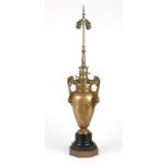 An American urn-form bronze lamp Circa 1890, the twisted finial over a two-light standard issuing