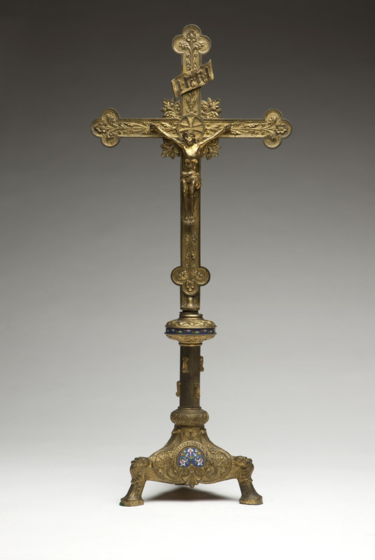 A Continental gilt bronze and champleve crucifix Late 19th century, stamped thrice to interior of