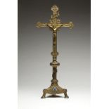 A Continental gilt bronze and champleve crucifix Late 19th century, stamped thrice to interior of