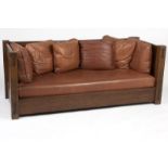 A Warren Hile oak settle with leather cushions Late 20th century, apparently unmarked, the slatted