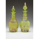 Two Bohemian cut and enameled glass decanters 19th century, each of lime-green glass, with an