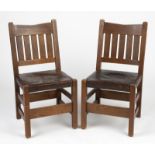 A pair of Gustav Stickley dining chairs, no. 354 1/2 1912-1916, each with Craftsman Workshops