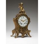 A Louis XV-style gilt bronze mantle clock Third quarter 19th century, the case signed in the