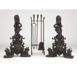 A pair of Renaissance-style cast bronze andirons 19th century, each surmounted by a standing lion