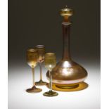 L.C. Tiffany Favrile decanter and 3 cordial stems Each cordial glass with etched signature to