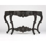 A Louis XV-style marble-top console table Late 19th/early 20th century, of ebonized walnut, the