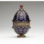 1024  A vermeil and enamel Faberge-style Easter egg 20th century, marked to underside of base "925",