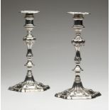 1205  A pair of George III sterling silver candlesticks 1766, London, each with partially rubbed