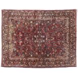 1056  A large Persian Sarouk woolen rug First half 20th century, wool on cotton foundation, the