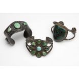 1094  Three Native American turquoise and silver cuffs  Three turquoise and silver cuffs, each set