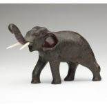 1050  A Japanese patinated bronze elephant Meiji period, signed to underside, a patinated and