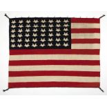 1105  A Navajo American flag pictorial rug Second quarter 20th century, a hand-woven rug of cream,