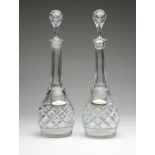 1170  A pair of English cut glass decanters  Circa 1930s, each sterling silver label tag marked