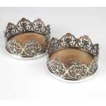 1167  A pair of English silver plate wine coasters  Late 19th/early 20th century, Sheffield, each