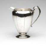 1218  A sterling silver "Londonderry" water pitcher First half 20th century, Boston, MA, with winged