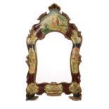 1038  A Venetian carved and polychromed wall mirror Second half 19th century, the shaped mirror