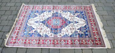 Ivory ground Kashmir rug with Aztec desi