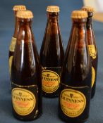 5 miniature Guiness bottles
