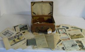 Small suitcase with assorted papers incl