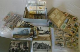 Various postcards, stamps and cigarette