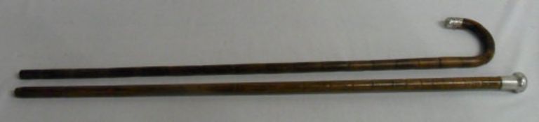 2 silver topped walking sticks (marks in