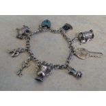 White metal charm bracelet, including 9 charms, only 3 marked as Silver