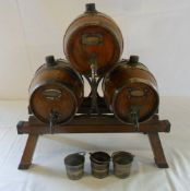 Trio of brass and wooden drinking barrel