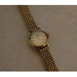 Ladies Omega watch with 9ct gold strap,