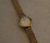 Ladies Omega watch with 9ct gold strap,