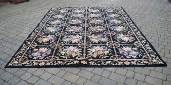 Large black Axminster carpet , 9' x 12'