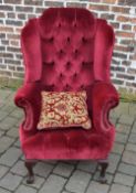 Red upholstered wingback armchair (shipp