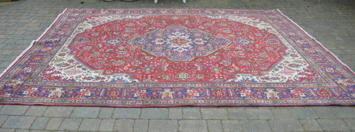 Handwoven Persian Tabriz rug with multic