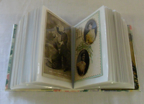 Postcard album containing miscellaneous cards